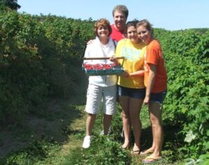raspberry u-pick with family in the orchard near Traverse City in Northern Michigan